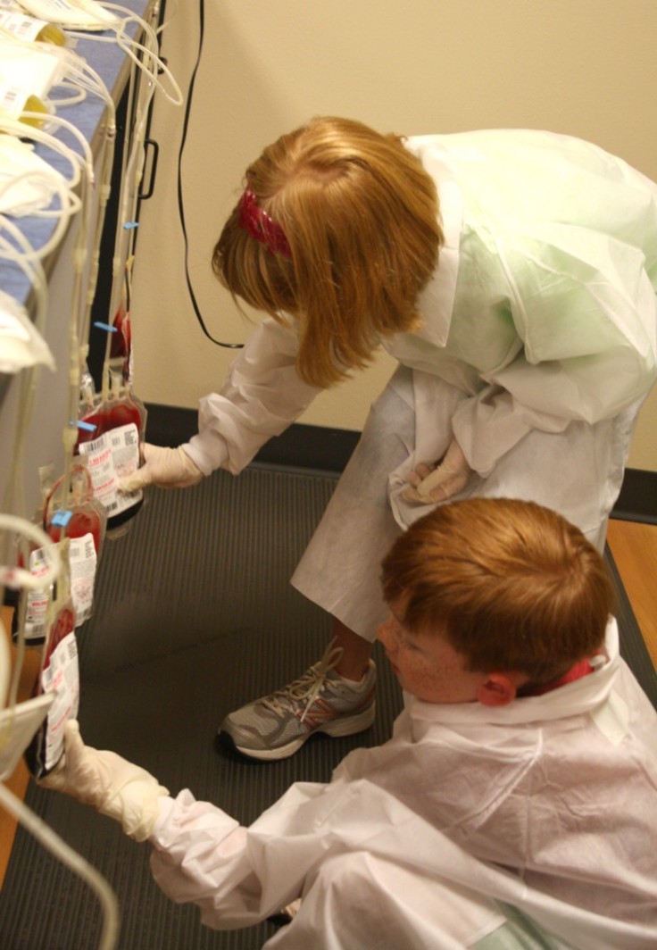 Examining the bags to be sure no plasma or white cells got in! Examining the bags to be sure no plasma or white cells got in!